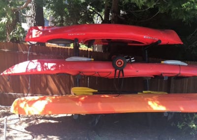 Photo of kayak racks with red kayaks